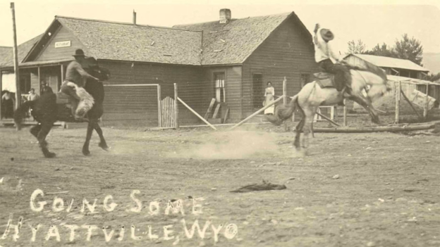 Black and White Image of Men on Horses - Labeled Going Some Hyattville, WYO