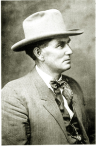 Vintage black and white portrait of man wearing cowboy hat